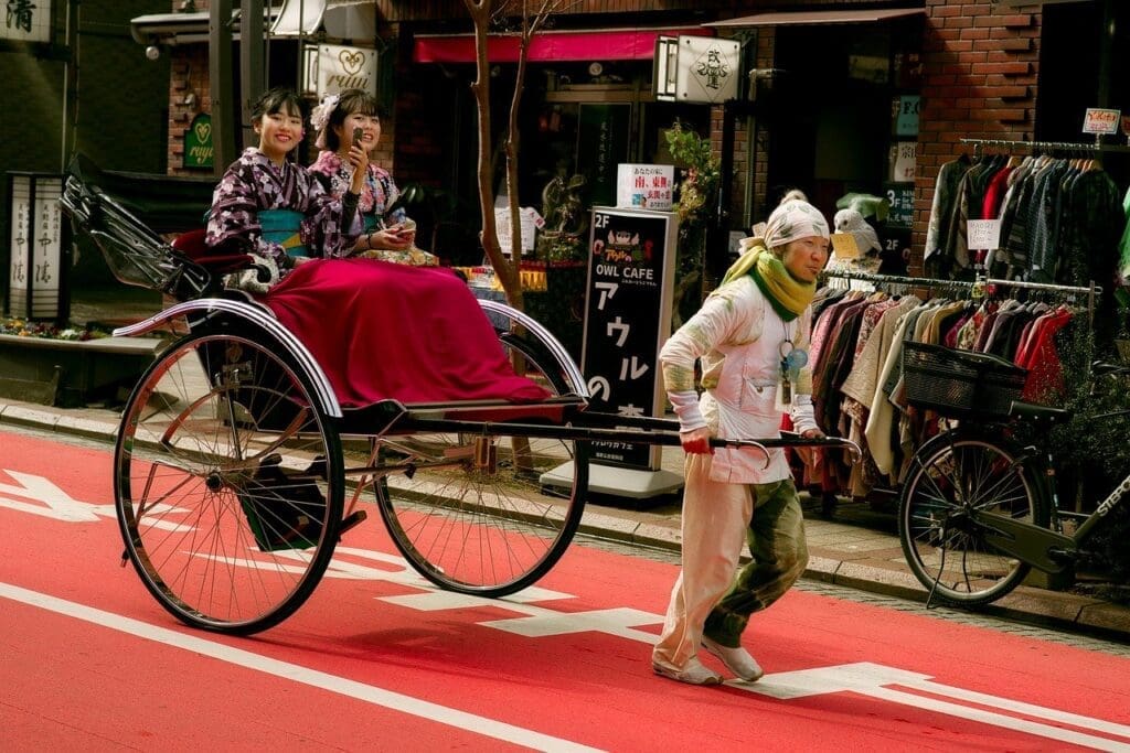 Rickshaw ride in Asakusa with two girls wearing kimono