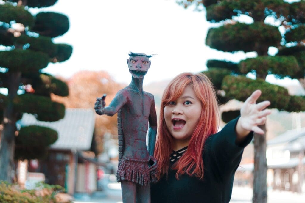 Reddish kappa statue at Tono Station. 