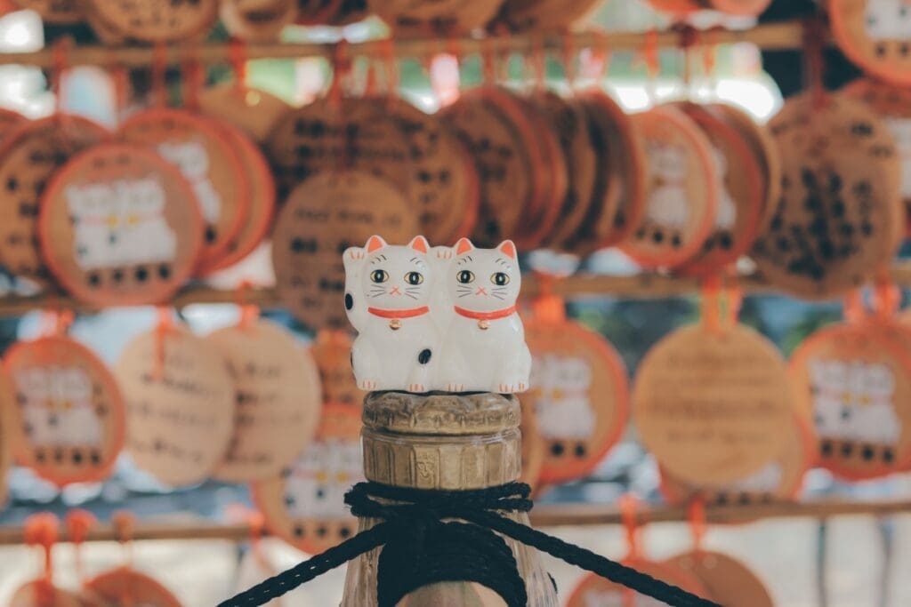 Imado Shrine maneki neko lucky cat figures on top of purification trough