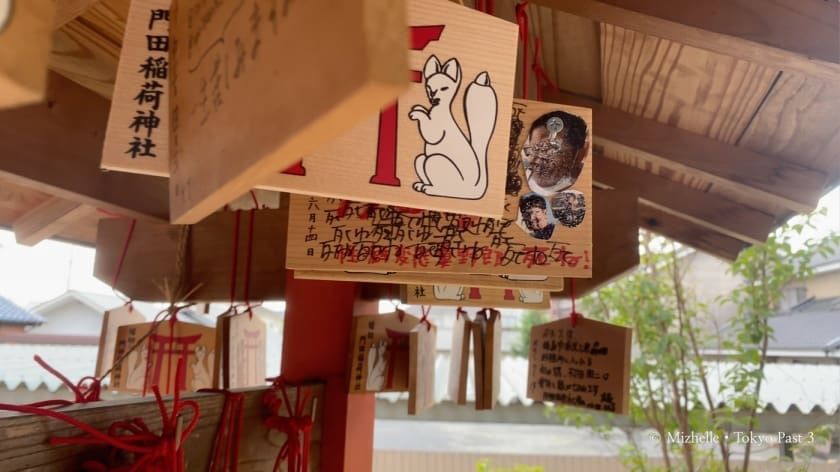 Prayer plaque at Kadota Inari with a photo that's been scribbled on