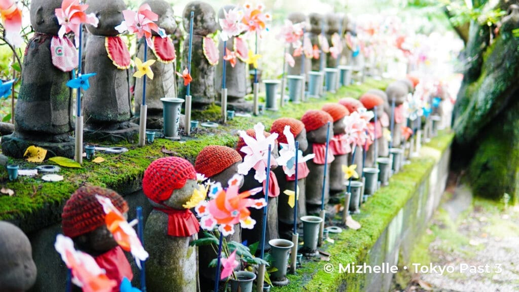 Jizo statues with pinwheels